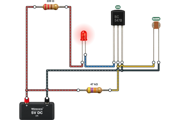 A light sensor, a BC547 transistor and a red LED, wired