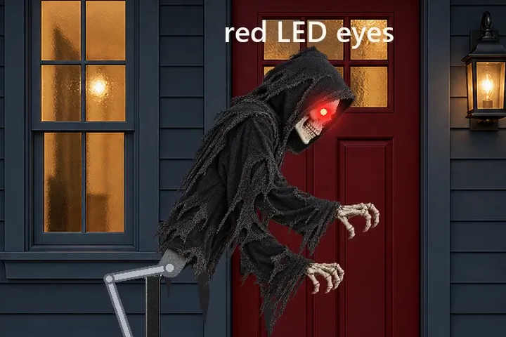 A US front porch at night with a red door, a lit window and a jack-o'-lantern: a hooded reaper with glowing red eyes lunges forward on a crank and lever driven by a 12 V worm gear motor, with the 1N4007 flyback diode on the motor's terminals and the 1k eye resistor on the porch floor beside it, a roller home switch and a STEP HERE mat nearby, and below the porch an orange wirecora.com board with an NE555 turned on its side, an IRFZ44N, 10k and 22k resistors, 100 uF, 1000 uF and 104 capacitors, a red +12 V rail along the top and a black ground rail along the bottom, a barrel jack and a 12 V 2 A adapter, all wired and labelled
